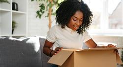 young woman opening a box